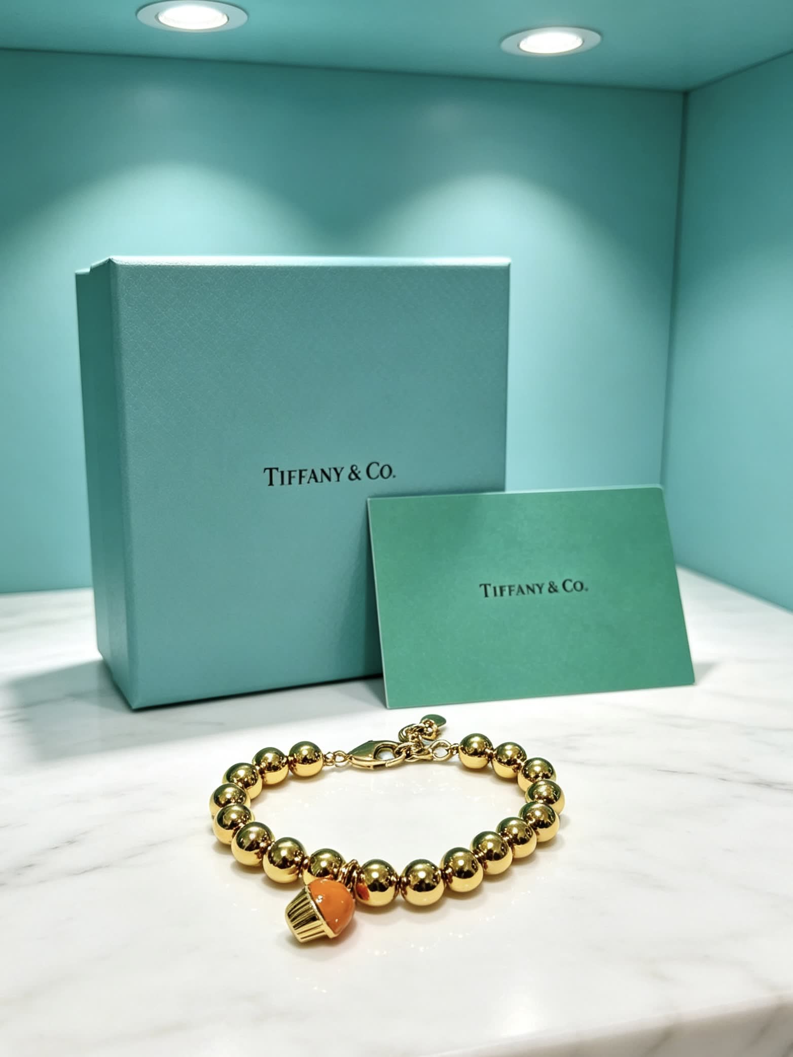 Tiffany & Co. Gold Bead Bracelet with Cupcake Charm
